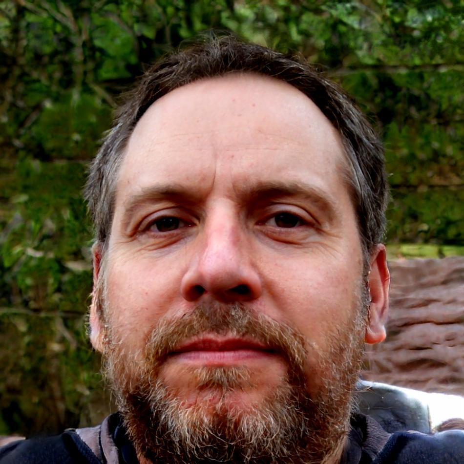 Professional headshot of behavioral finance specialist